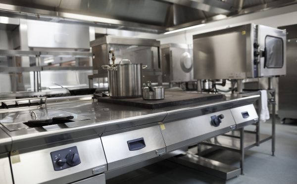 Picture Of Fully Equipped Professional Kitchen In Bright Light